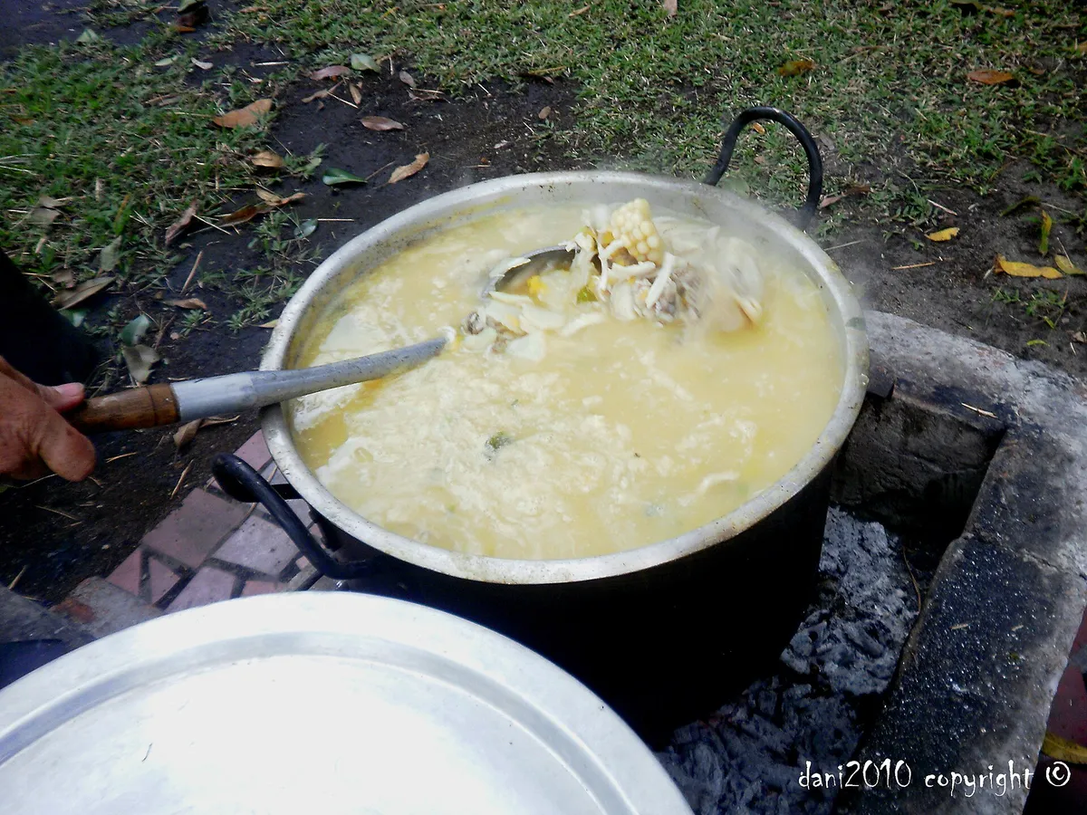A steaming bowl of ajiaco, the hot Colombian soup served at community meals